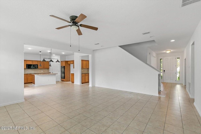 1415 Lantern Light Trl, Middleburg, FL 32068 - unfurnished living room featuring a ceiling fan, light tile patterned flooring, and recessed lighting