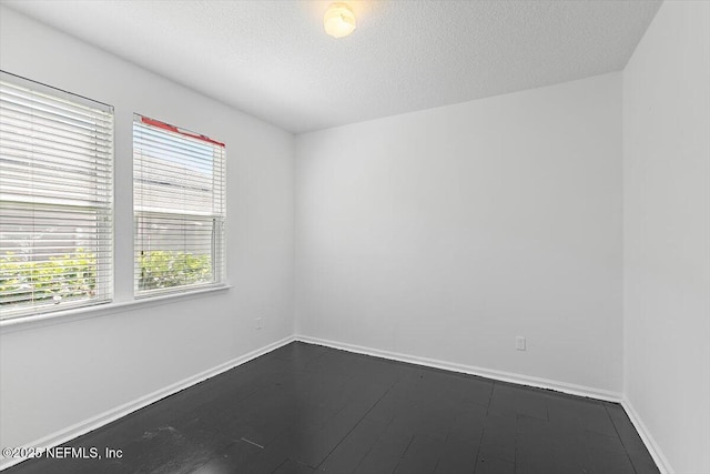1415 Lantern Light Trl, Middleburg, FL 32068 - empty room with baseboards and a textured ceiling