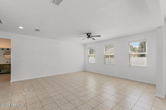 1415 Lantern Light Trl, Middleburg, FL 32068 - spare room with ceiling fan, a textured ceiling, recessed lighting, and light tile patterned flooring