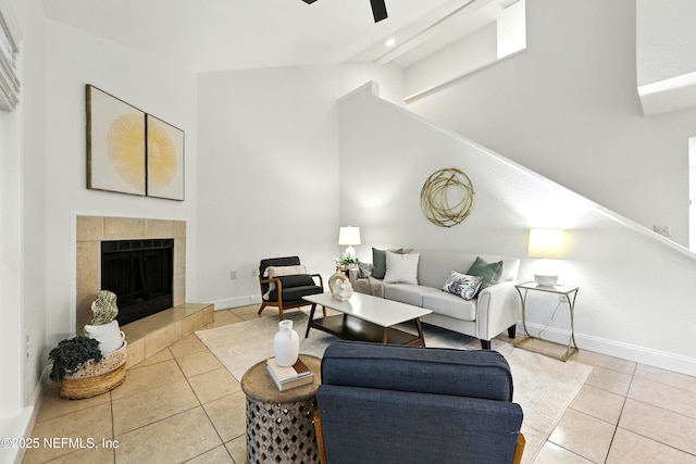 736 Tidewater Ct, Ponte Vedra Beach, FL 32082 - living room featuring light tile patterned floors, ceiling fan, lofted ceiling, and a tile fireplace