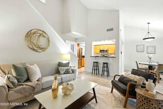 736 Tidewater Ct, Ponte Vedra Beach, FL 32082 - living room with high vaulted ceiling, light tile patterned flooring, and stairs