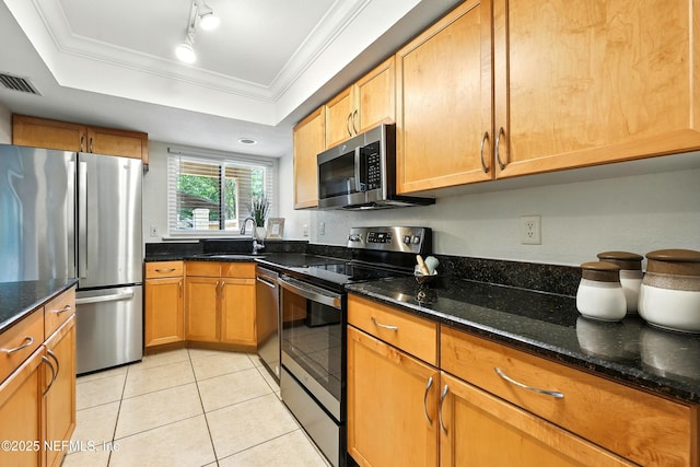 736 Tidewater Ct, Ponte Vedra Beach, FL 32082 - kitchen featuring stainless steel appliances, light tile patterned floors, dark stone countertops, and crown molding