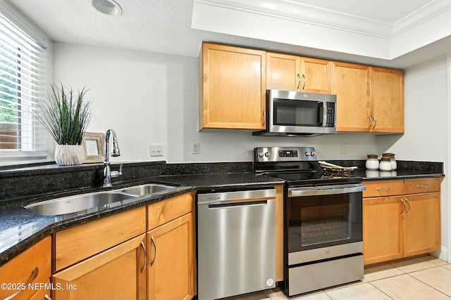 736 Tidewater Ct, Ponte Vedra Beach, FL 32082 - kitchen with appliances with stainless steel finishes, dark stone countertops, light tile patterned floors, ornamental molding, and a textured ceiling