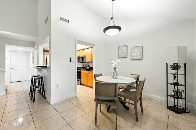736 Tidewater Ct, Ponte Vedra Beach, FL 32082 - dining room with a high ceiling and light tile patterned floors
