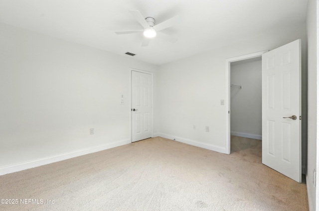736 Tidewater Ct, Ponte Vedra Beach, FL 32082 - unfurnished bedroom featuring light colored carpet, a walk in closet, and ceiling fan