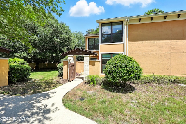 736 Tidewater Ct, Ponte Vedra Beach, FL 32082 - view of front of house featuring stucco siding