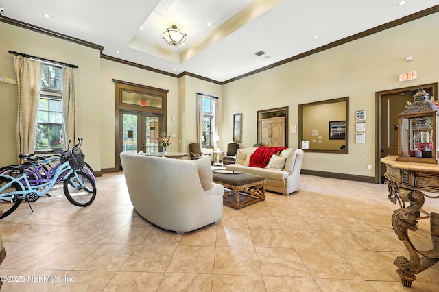 736 Tidewater Ct, Ponte Vedra Beach, FL 32082 - living room with crown molding, healthy amount of natural light, a high ceiling, light tile patterned floors, and french doors