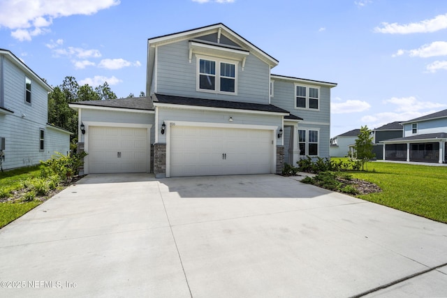 816 Blind Oak Way, Middleburg, FL 32068 - view of front facade with driveway, stone siding, a front yard, and a garage