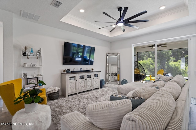 816 Blind Oak Way, Middleburg, FL 32068 - living area featuring a raised ceiling, a ceiling fan, ornamental molding, and recessed lighting
