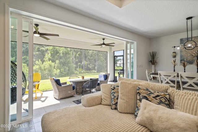 816 Blind Oak Way, Middleburg, FL 32068 - living room with a ceiling fan and a textured ceiling