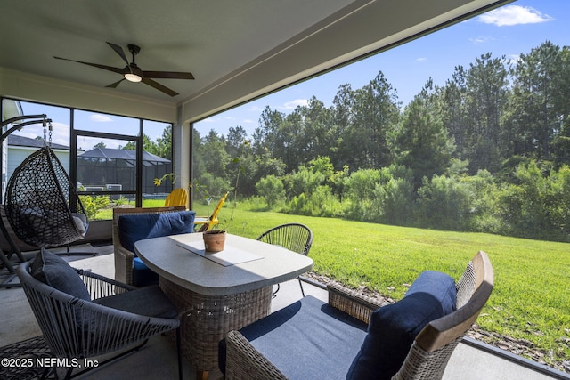 816 Blind Oak Way, Middleburg, FL 32068 - sunroom with a ceiling fan, outdoor dining space, and view of wooded area