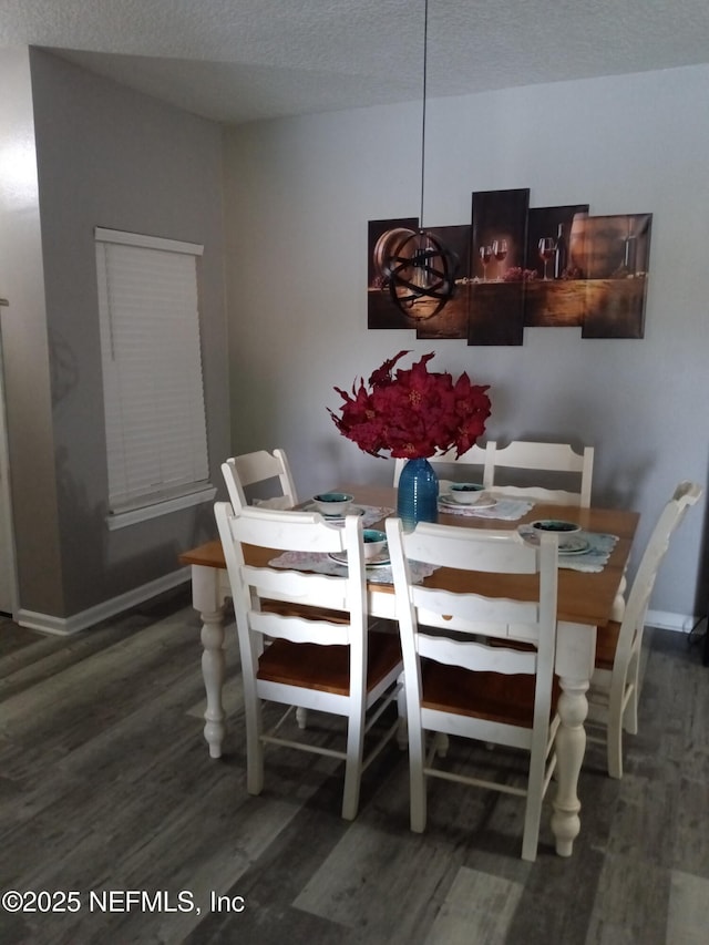 3671 Kirkpatrick Cir Unit 6, Jacksonville, FL 32210 - dining area with wood finished floors and a textured ceiling