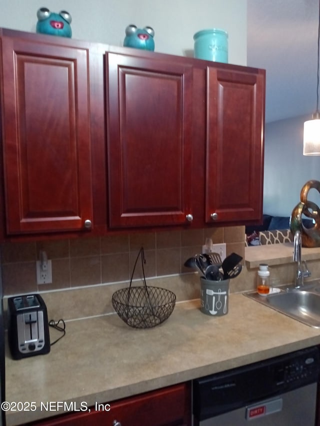 3671 Kirkpatrick Cir Unit 6, Jacksonville, FL 32210 - kitchen with dishwasher, reddish brown cabinets, decorative backsplash, and light countertops