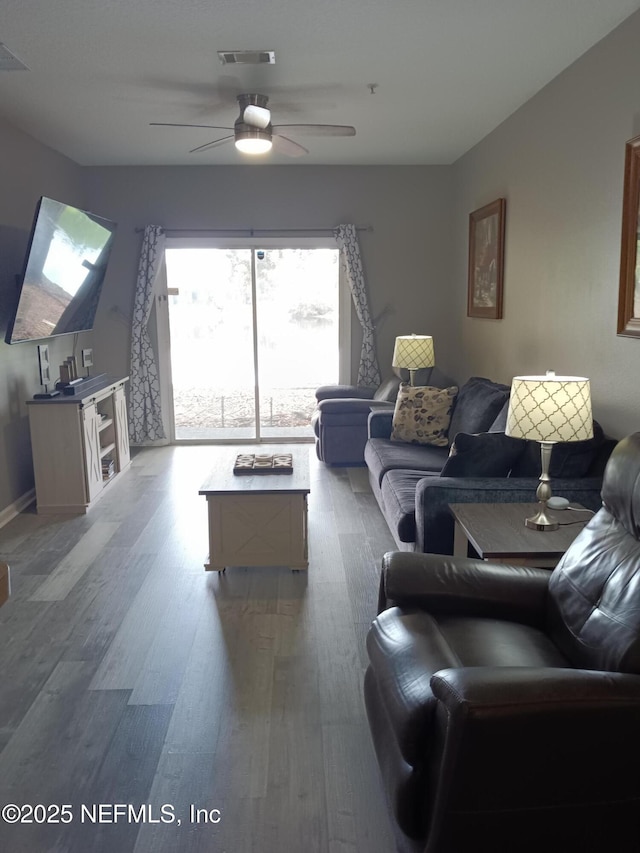 3671 Kirkpatrick Cir Unit 6, Jacksonville, FL 32210 - living room featuring wood finished floors and a ceiling fan