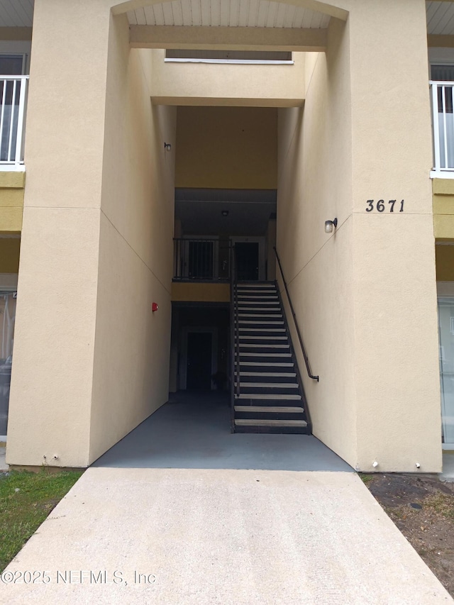 3671 Kirkpatrick Cir Unit 6, Jacksonville, FL 32210 - doorway to property with stucco siding