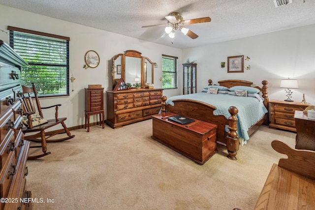 4253 Chokeberry Rd, Middleburg, FL 32068 - bedroom featuring light carpet, a textured ceiling, and a ceiling fan