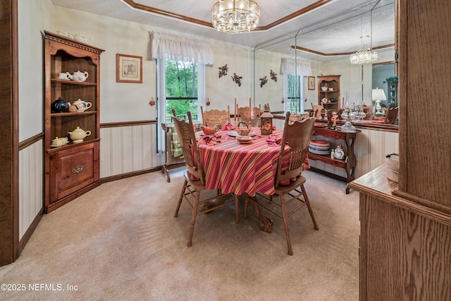 4253 Chokeberry Rd, Middleburg, FL 32068 - dining space with a chandelier, carpet flooring, a textured ceiling, a raised ceiling, and ornamental molding