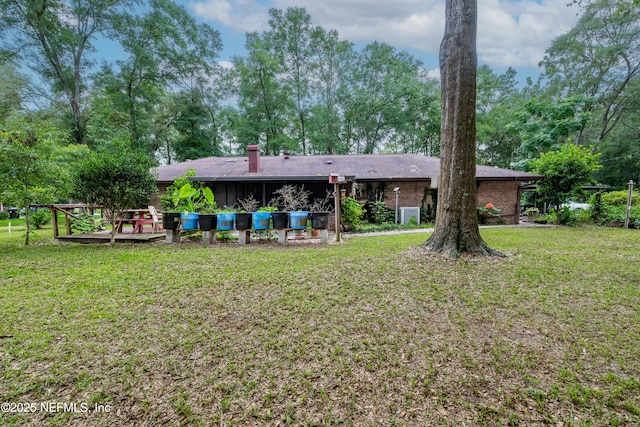 4253 Chokeberry Rd, Middleburg, FL 32068 - back of property with a yard and brick siding