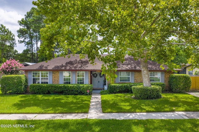 4115 Wilcrest Cir W, Jacksonville, FL 32277 - single story home with brick siding and a shingled roof