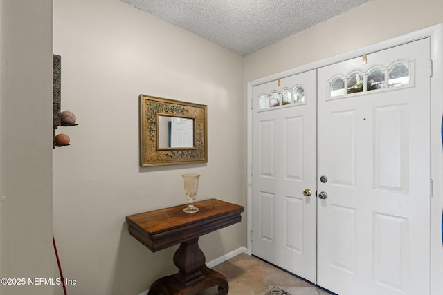 4115 Wilcrest Cir W, Jacksonville, FL 32277 - foyer with a textured ceiling and light tile patterned flooring