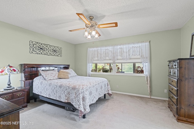 4115 Wilcrest Cir W, Jacksonville, FL 32277 - bedroom with light carpet, ceiling fan, and a textured ceiling