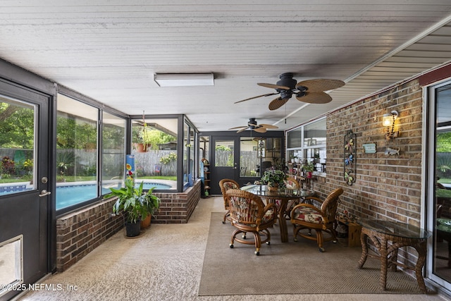 4115 Wilcrest Cir W, Jacksonville, FL 32277 - sunroom / solarium featuring a hot tub, a ceiling fan, and outdoor dining space