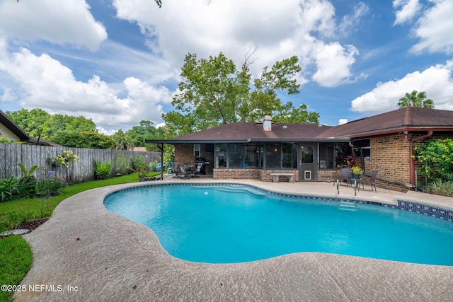 4115 Wilcrest Cir W, Jacksonville, FL 32277 - view of pool with a sunroom, a patio, and a fenced backyard