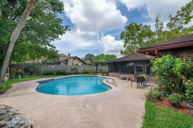 4115 Wilcrest Cir W, Jacksonville, FL 32277 - view of pool with a patio area, a fenced backyard, and a sunroom
