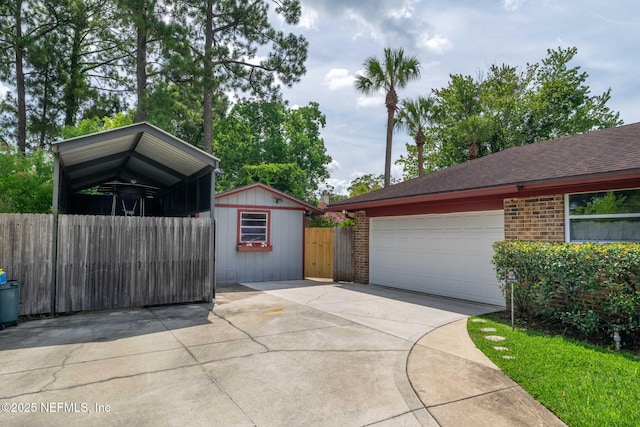 4115 Wilcrest Cir W, Jacksonville, FL 32277 - garage featuring concrete driveway and a gate