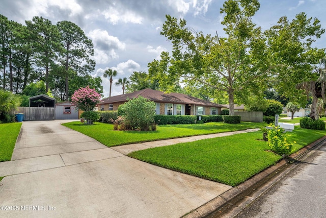 4115 Wilcrest Cir W, Jacksonville, FL 32277 - ranch-style house featuring driveway and a detached carport