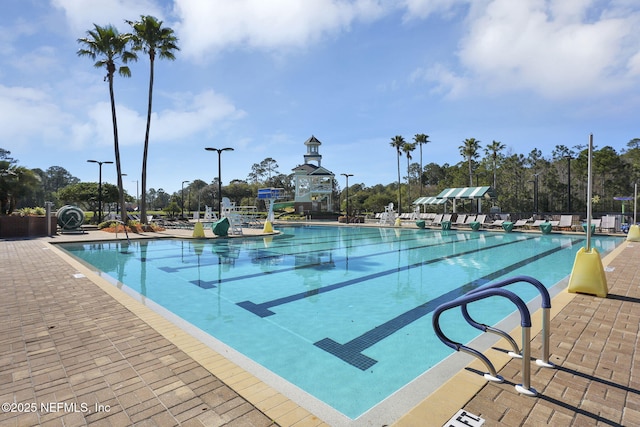 1506 Waterbridge Ct, Fleming Island, FL 32003 - community pool featuring a water slide and a patio area