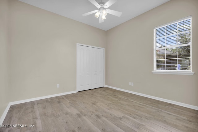 1506 Waterbridge Ct, Fleming Island, FL 32003 - unfurnished bedroom with wood finished floors, a closet, and ceiling fan