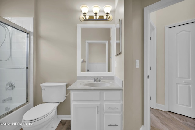 1506 Waterbridge Ct, Fleming Island, FL 32003 - full bath featuring vanity, wood finished floors, and enclosed tub / shower combo