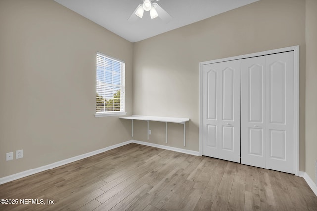 1506 Waterbridge Ct, Fleming Island, FL 32003 - unfurnished bedroom with wood finished floors, a closet, and ceiling fan