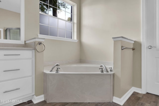 1506 Waterbridge Ct, Fleming Island, FL 32003 - bathroom with wood finished floors, a bath, and vanity