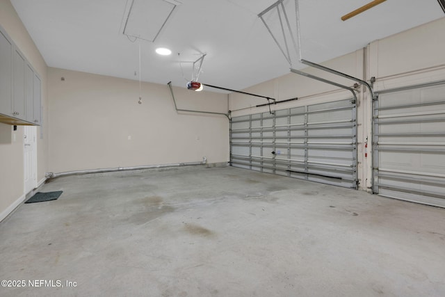 1506 Waterbridge Ct, Fleming Island, FL 32003 - garage with a garage door opener and baseboards