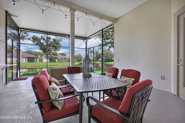 1506 Waterbridge Ct, Fleming Island, FL 32003 - sunroom with outdoor dining space and a water view