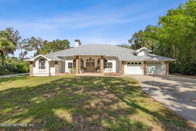 1465 Lambert Ave, Flagler Beach, FL 32136 - view of front of property with concrete driveway, a garage, brick siding, a front lawn, and a chimney