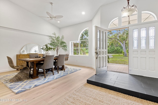 1465 Lambert Ave, Flagler Beach, FL 32136 - dining area with wood finished floors, high vaulted ceiling, ceiling fan, and recessed lighting