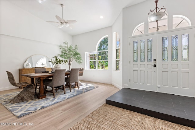 1465 Lambert Ave, Flagler Beach, FL 32136 - entryway with wood finished floors, high vaulted ceiling, a ceiling fan, and recessed lighting