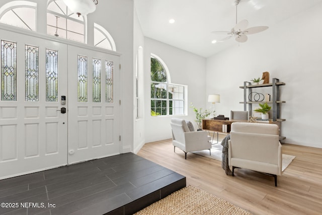 1465 Lambert Ave, Flagler Beach, FL 32136 - entrance foyer with wood finished floors, ceiling fan, recessed lighting, and a towering ceiling