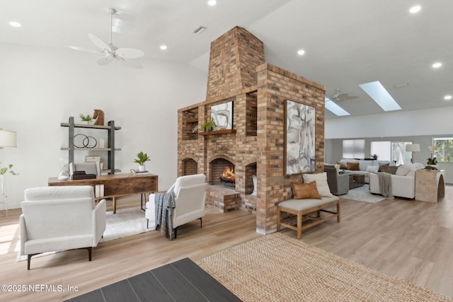 1465 Lambert Ave, Flagler Beach, FL 32136 - living room featuring wood finished floors, a skylight, recessed lighting, high vaulted ceiling, and a desk