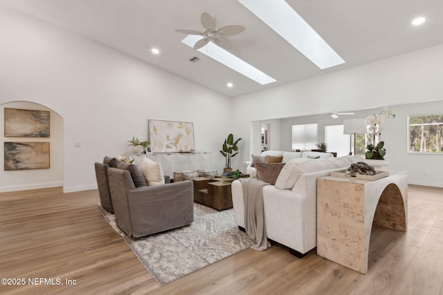 1465 Lambert Ave, Flagler Beach, FL 32136 - living room featuring high vaulted ceiling, light wood finished floors, ceiling fan, recessed lighting, and a skylight