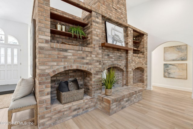 1465 Lambert Ave, Flagler Beach, FL 32136 - unfurnished living room with wood finished floors and a fireplace