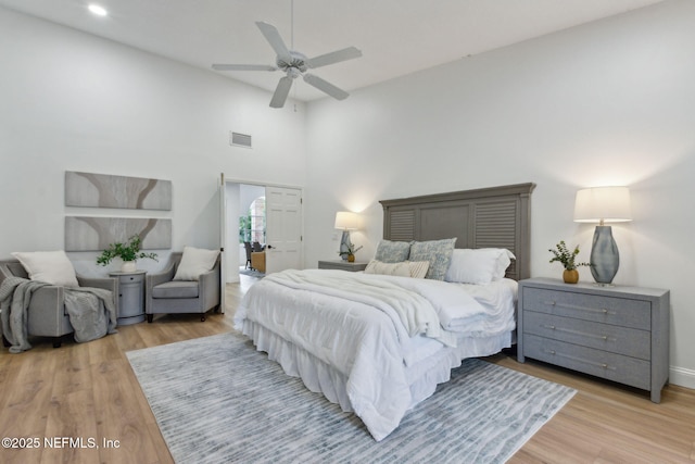 1465 Lambert Ave, Flagler Beach, FL 32136 - bedroom featuring light wood-style flooring, recessed lighting, a towering ceiling, and a ceiling fan