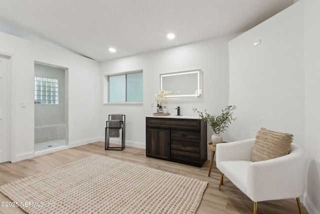 1465 Lambert Ave, Flagler Beach, FL 32136 - sitting room with light wood-style flooring and recessed lighting