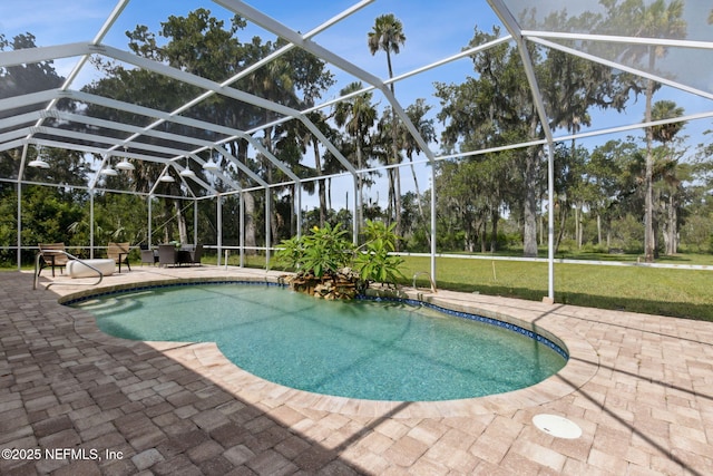 1465 Lambert Ave, Flagler Beach, FL 32136 - outdoor pool featuring a patio area, view of wooded area, a lanai, and a yard