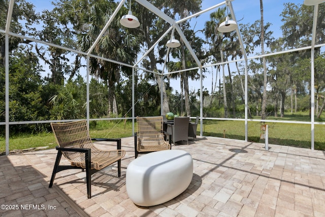 1465 Lambert Ave, Flagler Beach, FL 32136 - unfurnished sunroom featuring view of scattered trees and outdoor dining area