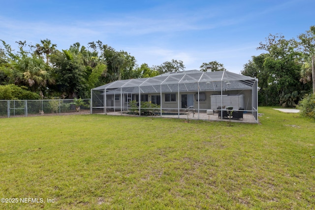 1465 Lambert Ave, Flagler Beach, FL 32136 - back of house featuring a patio, a chimney, and glass enclosure