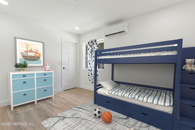 1465 Lambert Ave, Flagler Beach, FL 32136 - bedroom featuring a wall mounted AC and wood finished floors